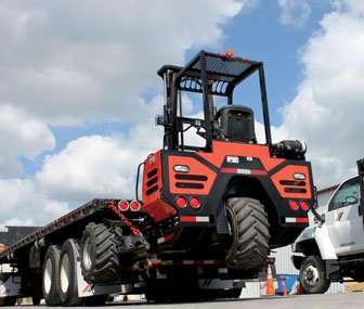 Palfinger GT55 PALreach Crayler Forklift shown stowed in travel position on truck chassis.